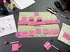 Pink post it notes on a table with story notes for an animation