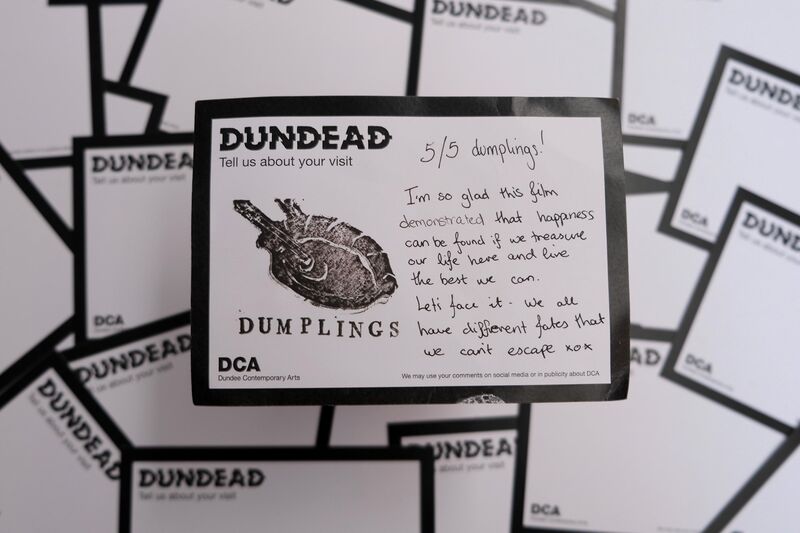 Handwritten Dundead comment card: ‘5/5 dumplings! I’m so glad this film demonstrated that happiness can be found we treasure our life here and live the best we can. Lets face it - we all have different fates that we can’t escape’ with drawing of a dumpling being picked up by chopsticks