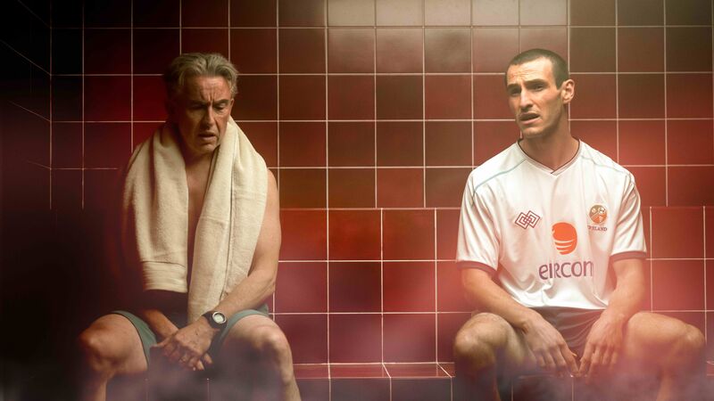 Two men sit together in the steam room