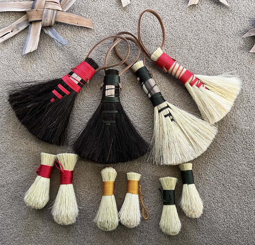 Selechtion of small and large brushes with different coloured thread