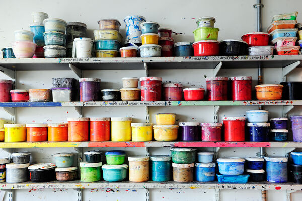 4 Shelves in DCA Print Studio filled with different paints.