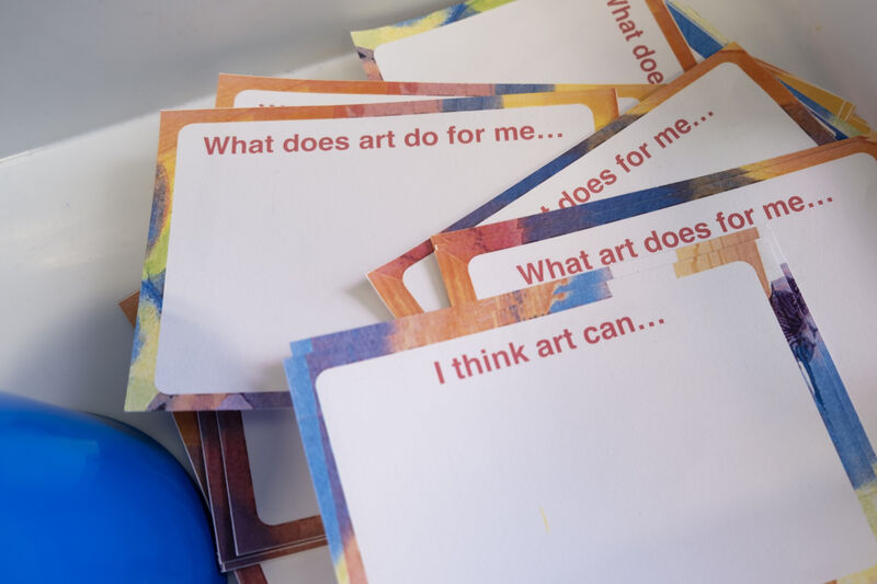 Comment cards with sentences to finish, including 'I think art can...' and 'What does art do for me...'