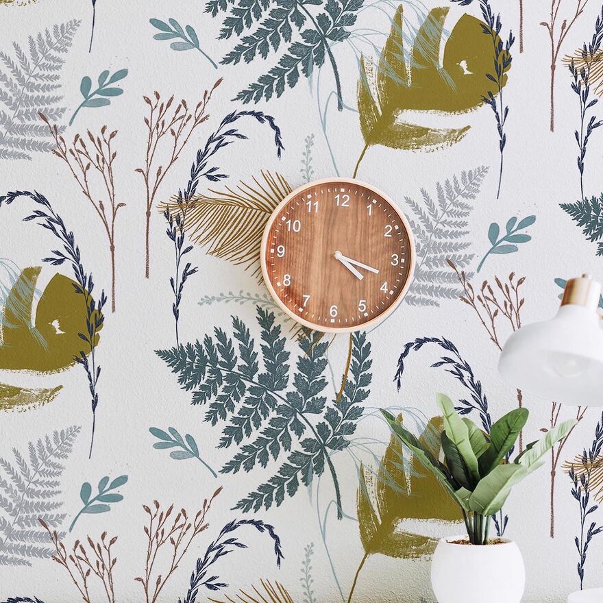 Wall with printed wallpaper and wall clock