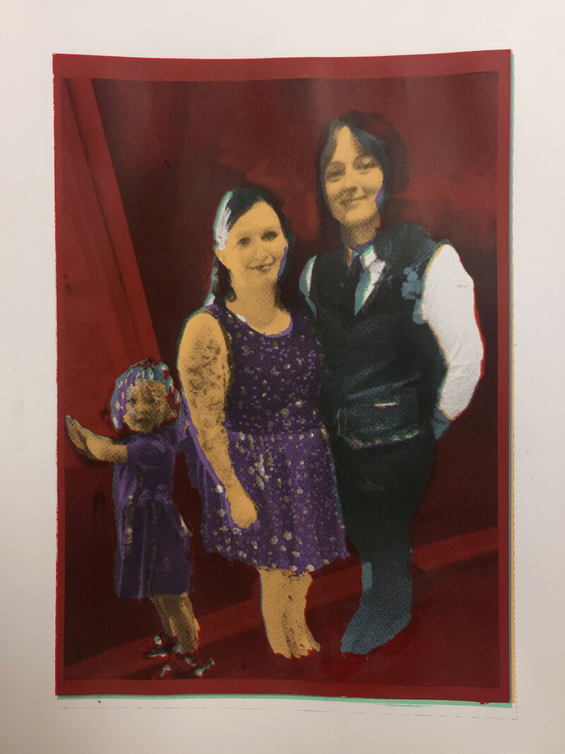 Screenprint of two people and a child posing for a photo