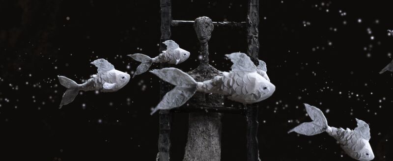Animated still of fish swimming past a human character