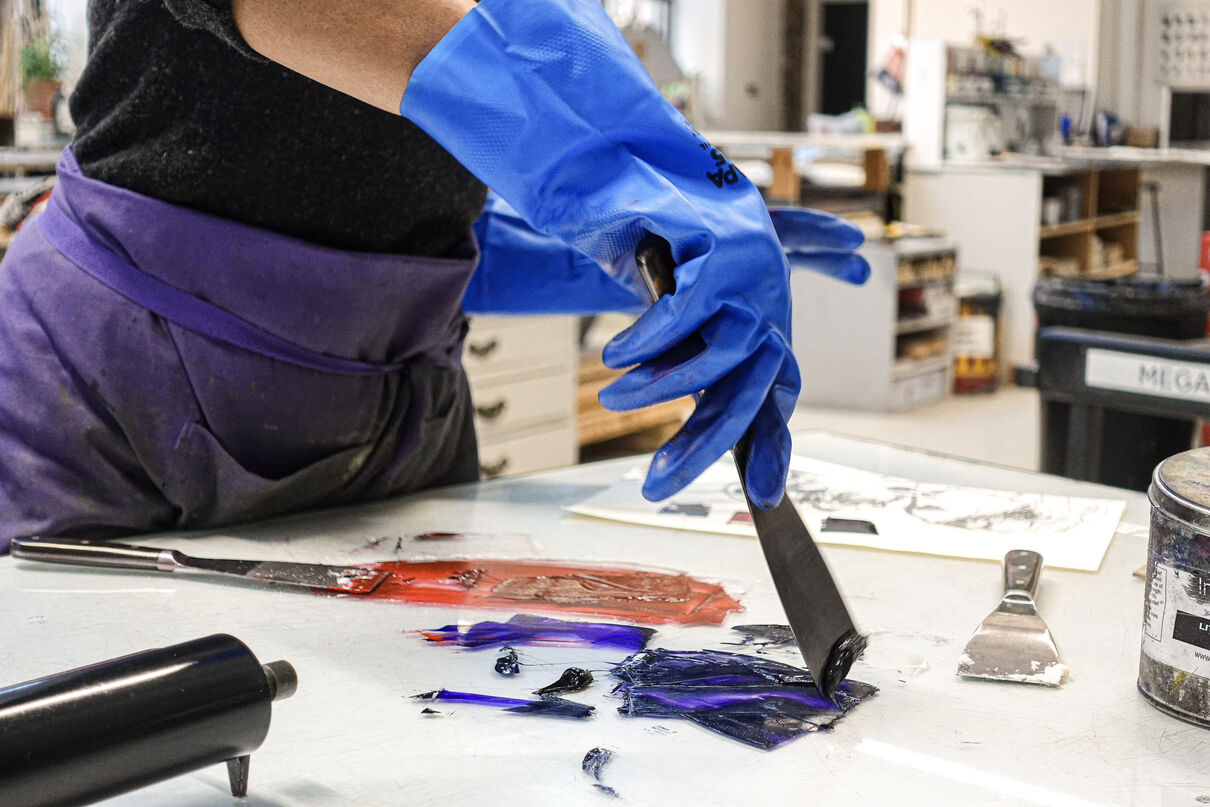 Person spreading ink