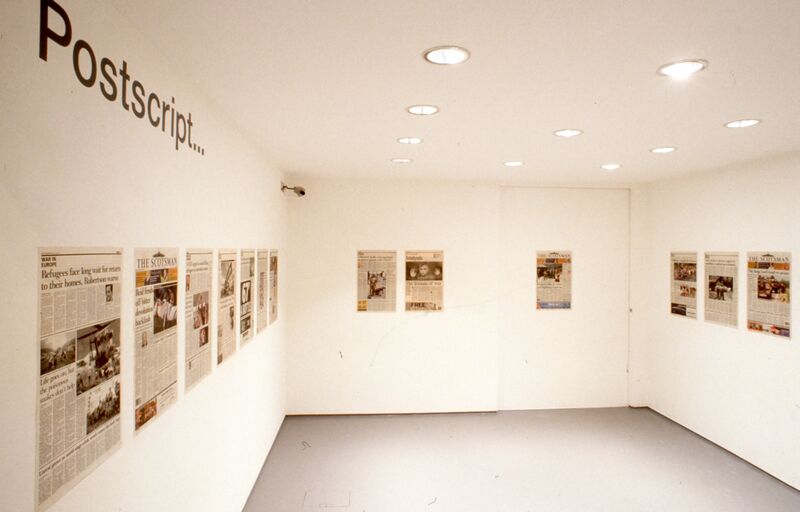 Newspaper clippings hang on white walls. Text above them says 'Postscript...'