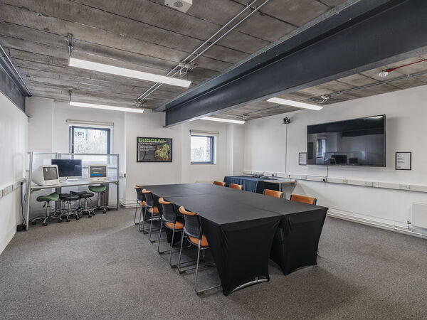 A room with a large table 