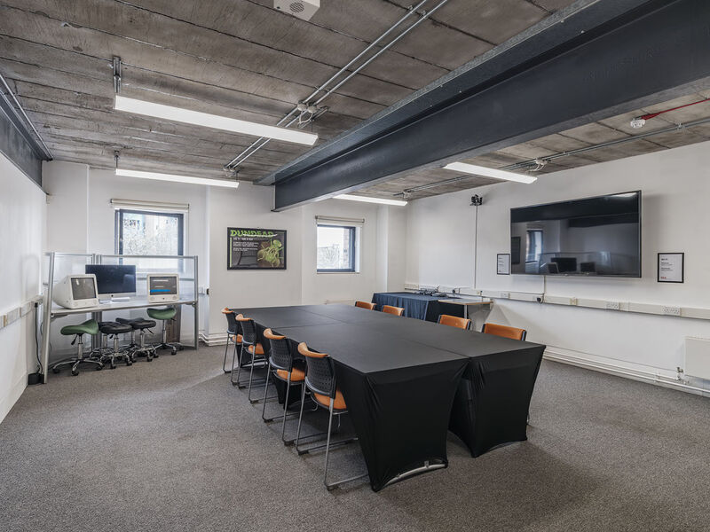 A room with a large table 