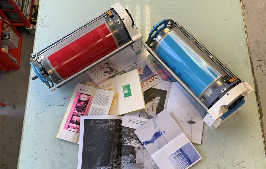 Table with zines and riso drums