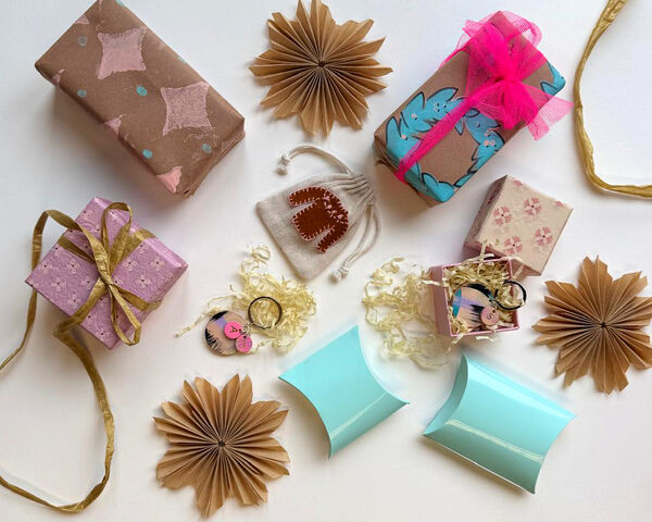 Selection of christmas gift wrap in brown, pink and blue
