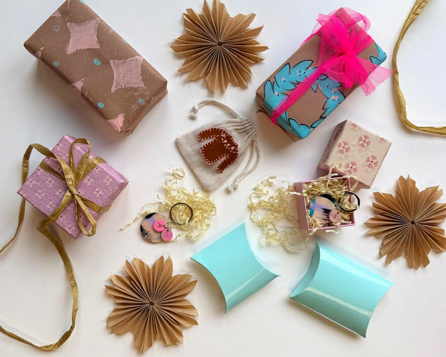 Selection of christmas gift wrap in brown, pink and blue