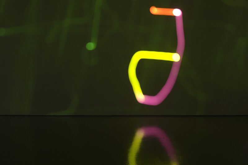 From Torsten Lauschmann's exhibition in DCA. Blurry lights, in pink, yellow, orange and green, are projected on to DCA' gallery wall.