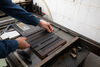 Person making a letterpress print in Limerick Printmakers