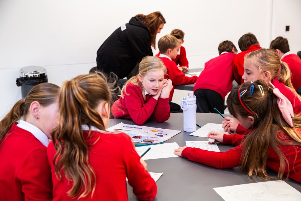 A class of children working on art at DCA