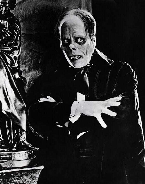 Lon Chaney as The Phantom of the Opera crossing his arms