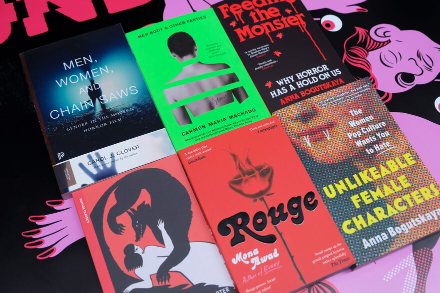 Six paperback books selected for Invisible Women's Dundead Reading List, including Men, Women and Chainsaws, Her Body and Other Parties, Feeding the Monster, The Bloody Chamber, Rouge and Unlikeable Female Characters