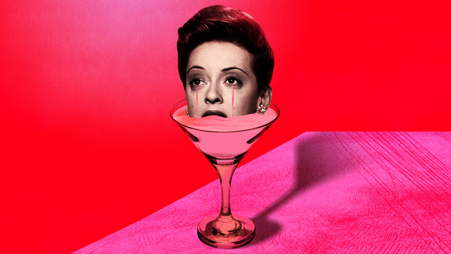 A black-and-white woman's head with pink tears emerges from a martini glass, against a pink and red background.