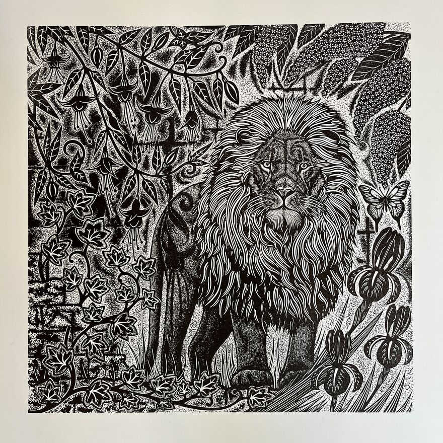 Intricate print of a lion surrpunded by plant life