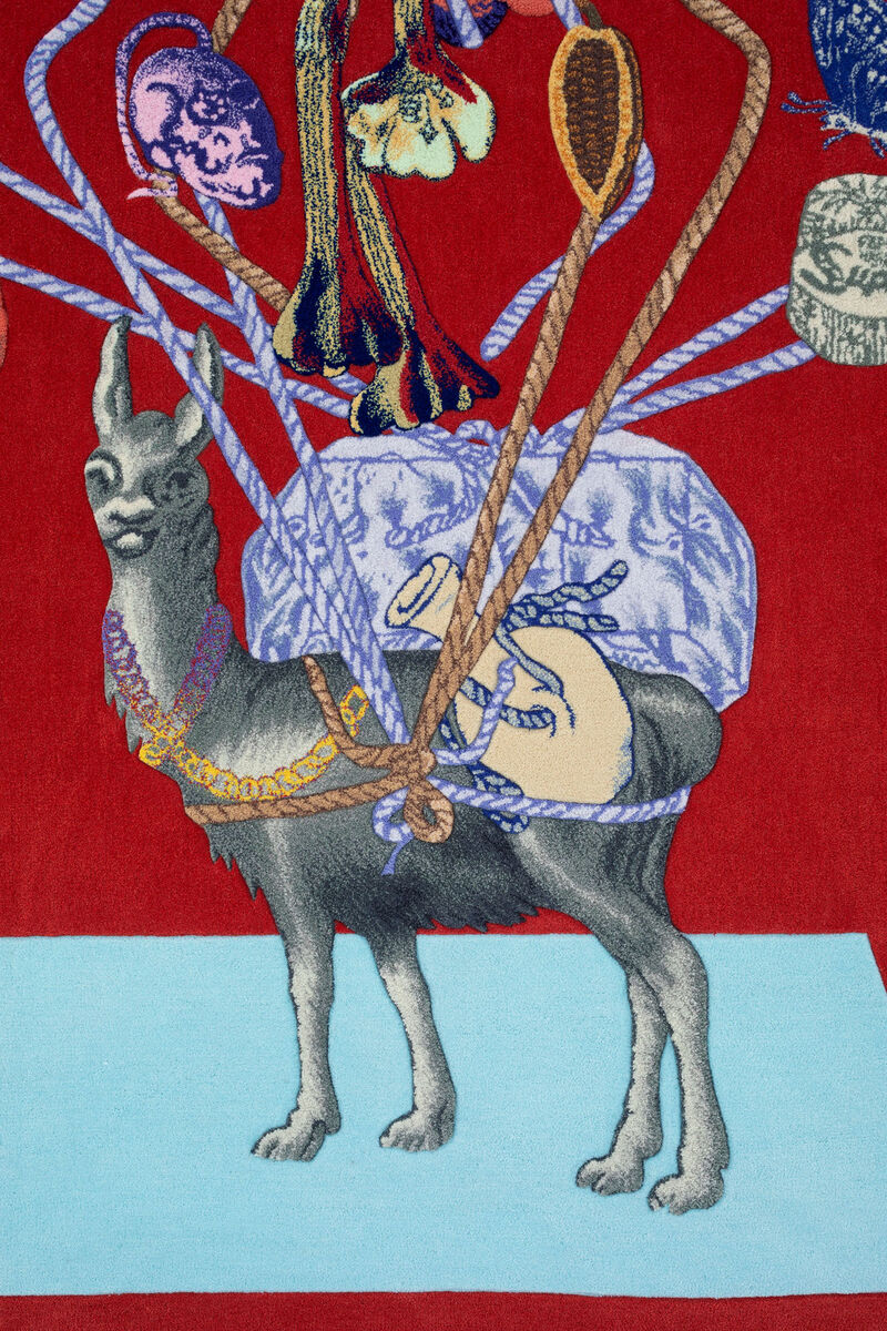 Close-up of a tufting by Claudia Martínez Garay showing a vicuna with object strapped to its back