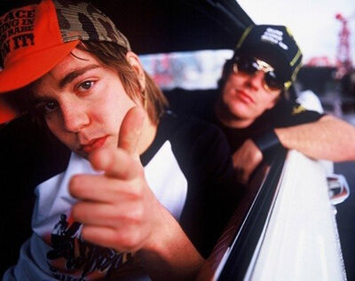 Dundee rappers Silibil N Brains in a car, wearing caps and sunglasses