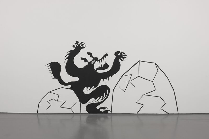 A mural from Hideyuki Katsumata's exhibition shows a black, dragon-like figure appearing from behind a rock.