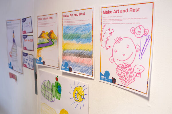Children's drawings on the wall of Create Space as part of Make Art and Rest activity
