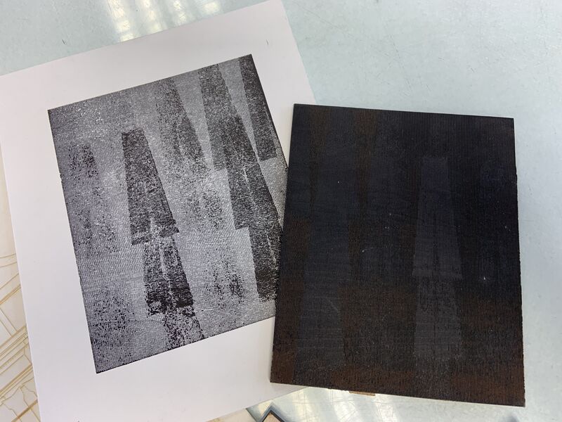 Example of a laser cut printing block with teh resulting print with V shape design
