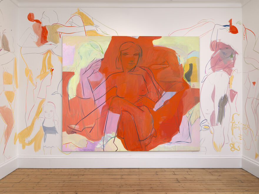 A large canvas on a wall with the painted images of women spilling onto the wall itself