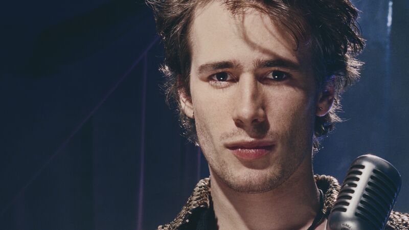 A close-up image of Jeff Buckley next to a microphone