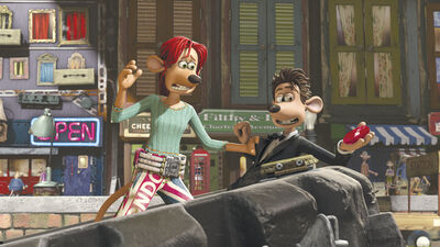 A claymation female rat looks worried at a smiling claymation male rat