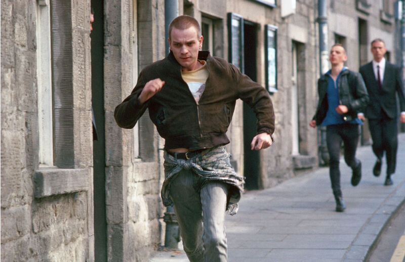 A young man runs down the street
