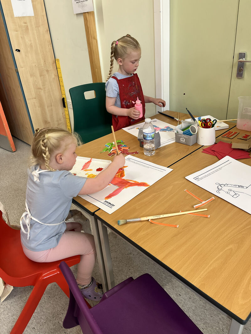 Two children at a table painting