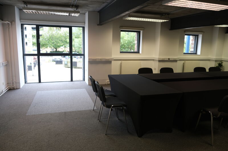 View of a large window at the top of a meeting room table