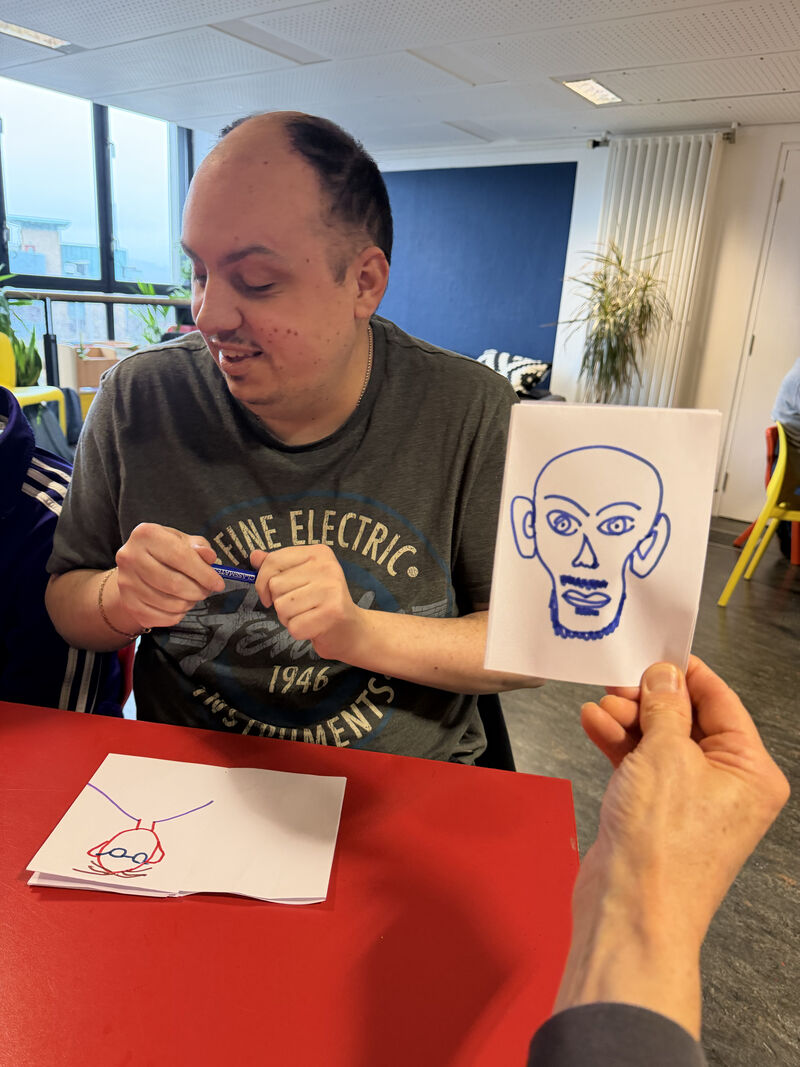 People drawing portraits of each other