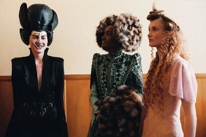 Three models wearing Alexander McQueen outfits