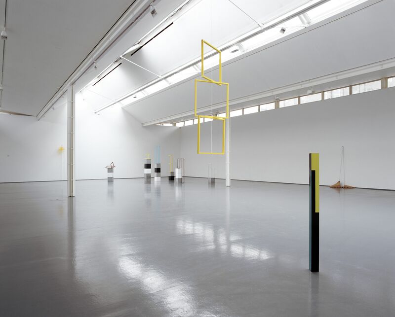 From Camilla Løw's exhibition in DCA Galleries. 3 yellow, square frames hang from the ceiling as an installation.