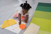 Child mixing paint