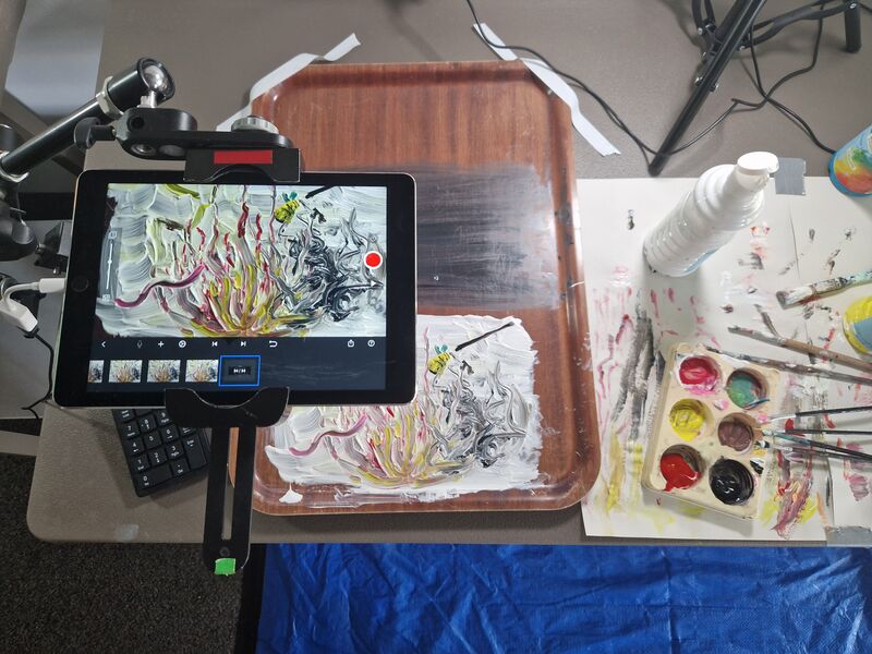 Set up for filming an animation created using paint