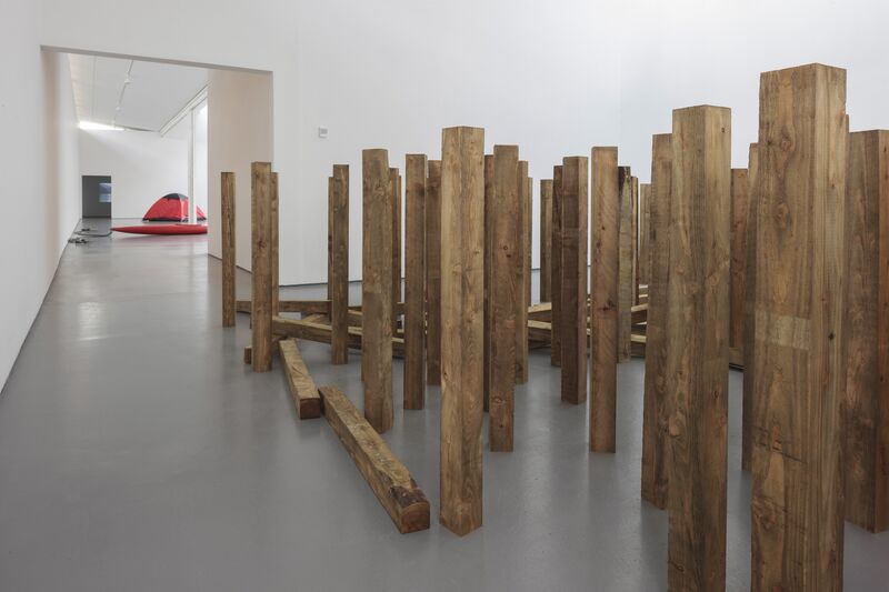 DCA during Roman Signer's exhibition. Plywood plinths stand upright in the gallery. Some have fallen over like dominos.