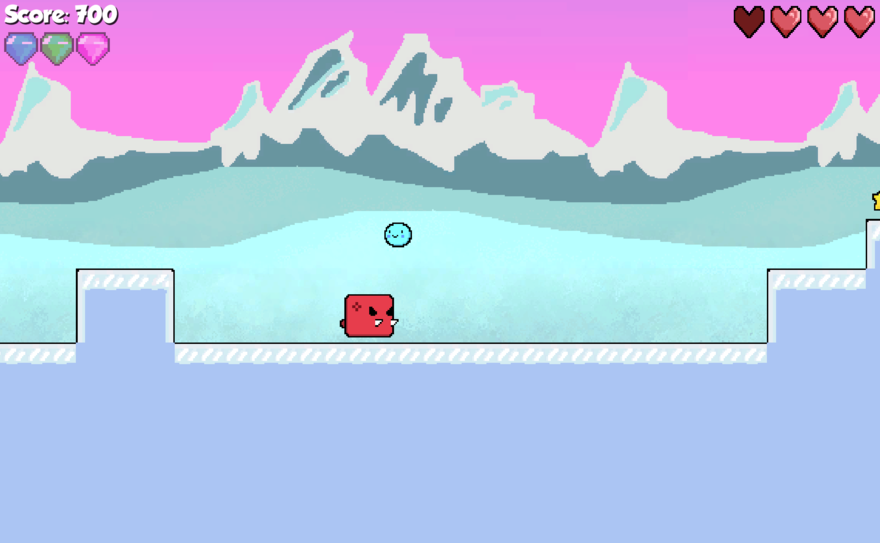 A computer game screenshot shows a little blue circle jumping over an angry mammoth.
