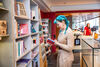Person looking at books in DCA Shop