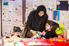 Adult and two children in Create Space