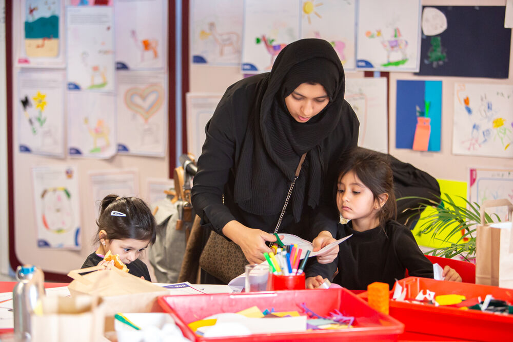 Adult and two children in Create Space