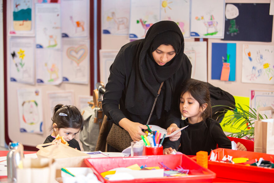 Adult and two children in Create Space