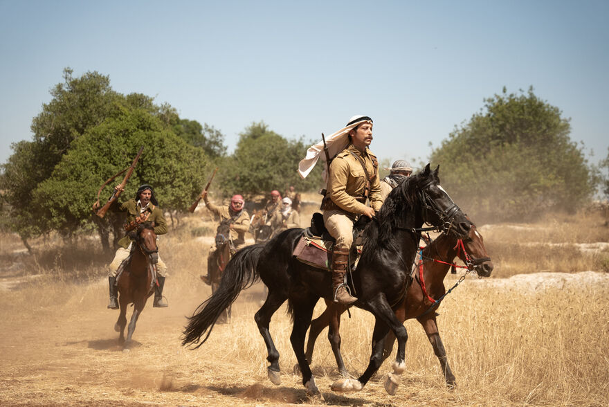 A group of Palestinian men ride horses in 1936.
