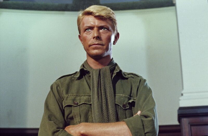David Bowie stands in military uniform