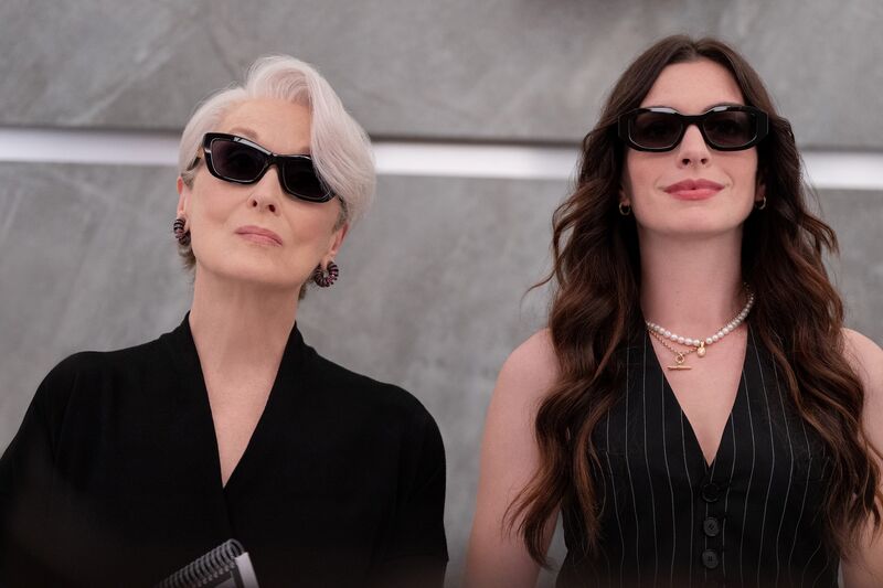 Two glam women in fashionable sunglasses, smiling