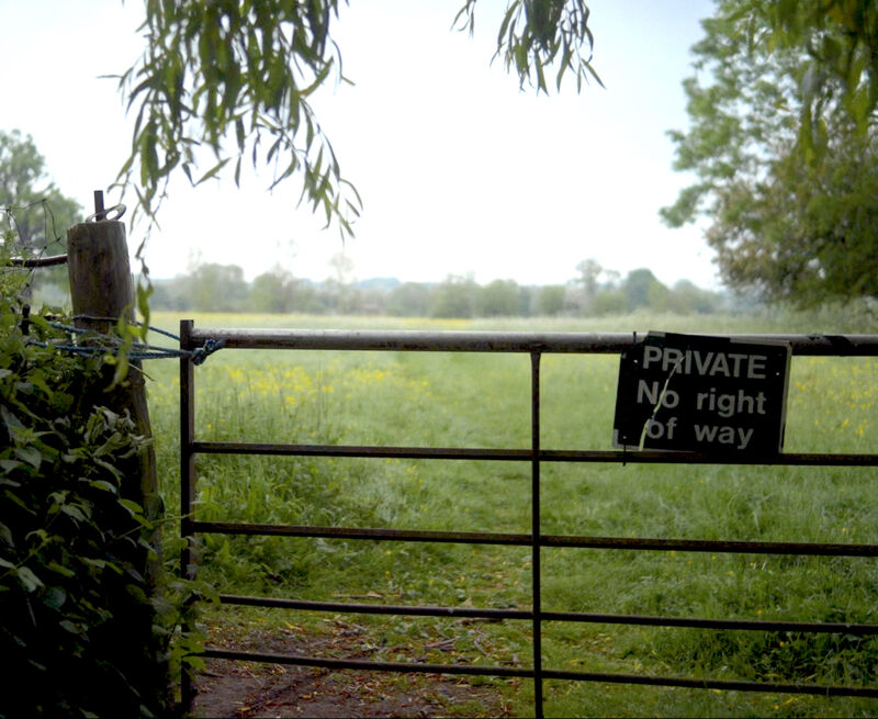 A 'Private no right of way' sign on a gate
