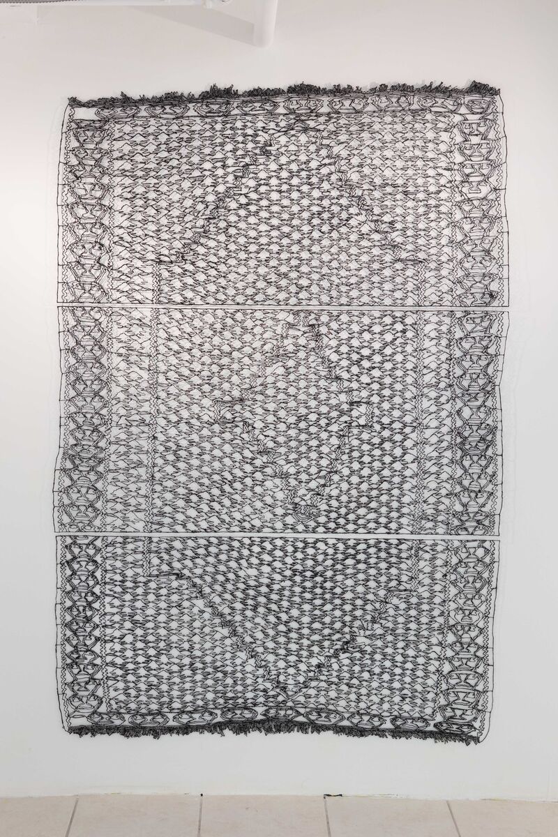 A large artwork delicately recreating a traditional rug in hand-drawn 3D filament